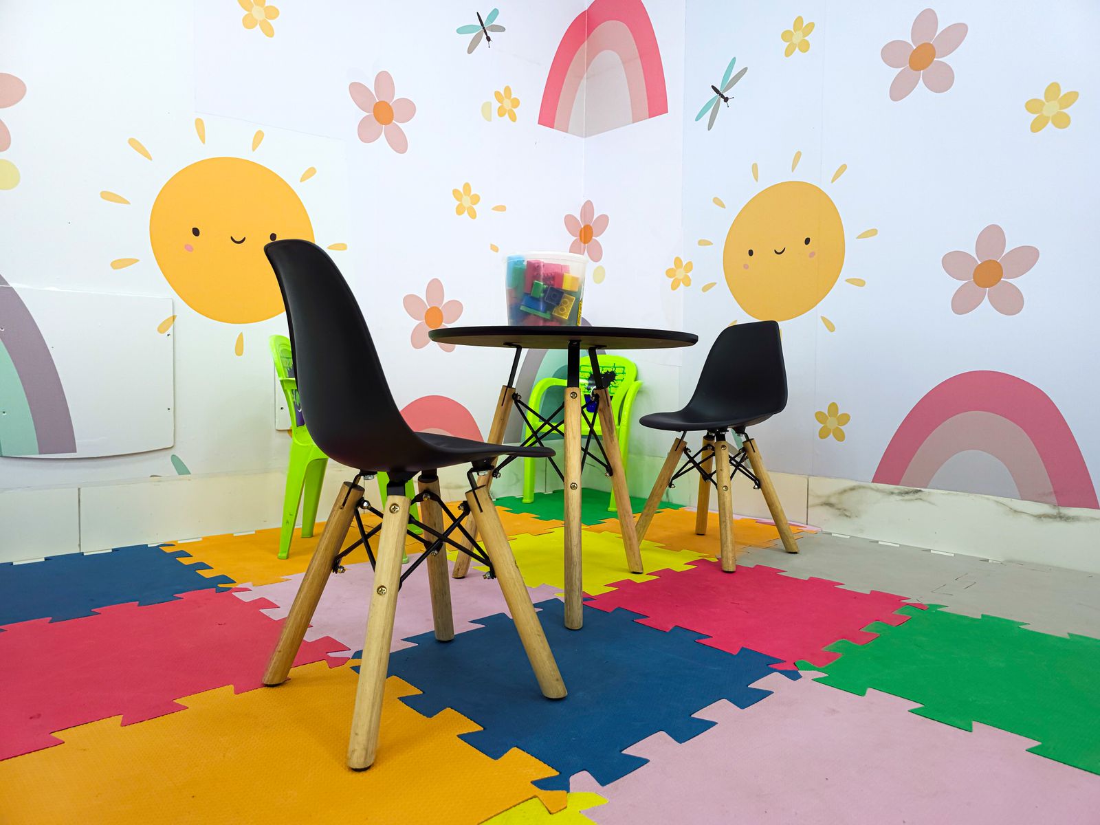 A bright clinic reception area with wooden furniture and plants