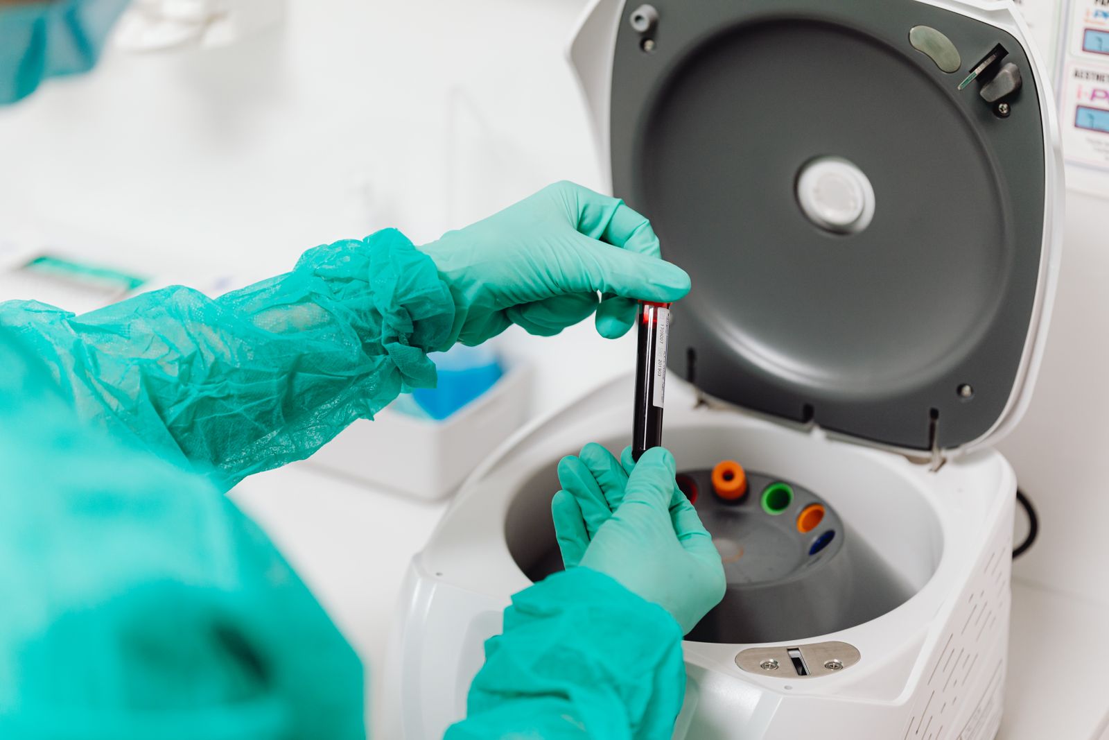 Laboratory sample tubes being handled with gloves