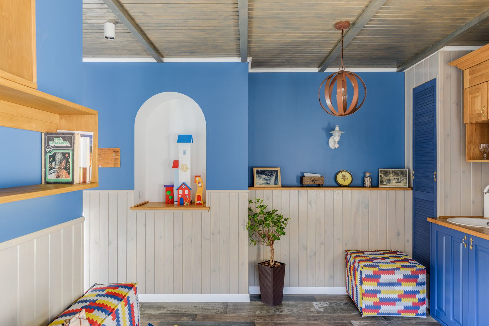 A calm room with soft seating and colourful walls